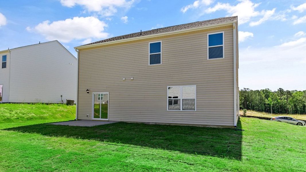 Exterior details and patio area of a home in East Ridge, Ayden (Image 23).
