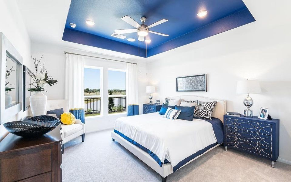 Spacious and inviting primary bedroom offering a peaceful retreat, featuring high ceilings, plush carpeting, and plenty of room for a sitting area, the perfect place to unwind at the end of the day. **Photos are representative only and may vary as built.**