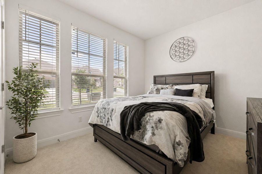 First floor guest bedroom, next to a full bath