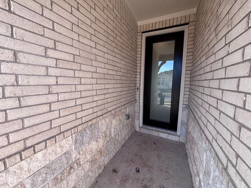 Exterior details and patio area of a home in The Colony, Bastrop (Image 3).