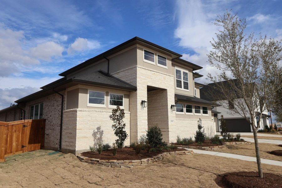 Front exterior of a new home in Dunham Pointe, Cypress, TX, highlighting curb appeal (Image 19).