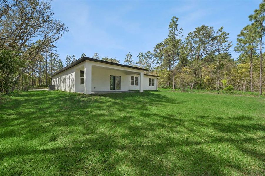 Exterior details and patio area of a home in , Citrus Springs (Image 23).