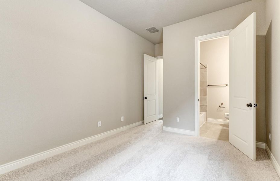 Spacious, unfurnished interior of a new home in The Woodlands Hills 65′, Willis (Image 48).