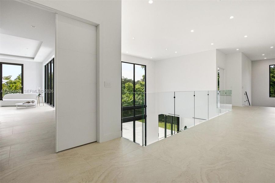 Hallway with glass doors to the patio