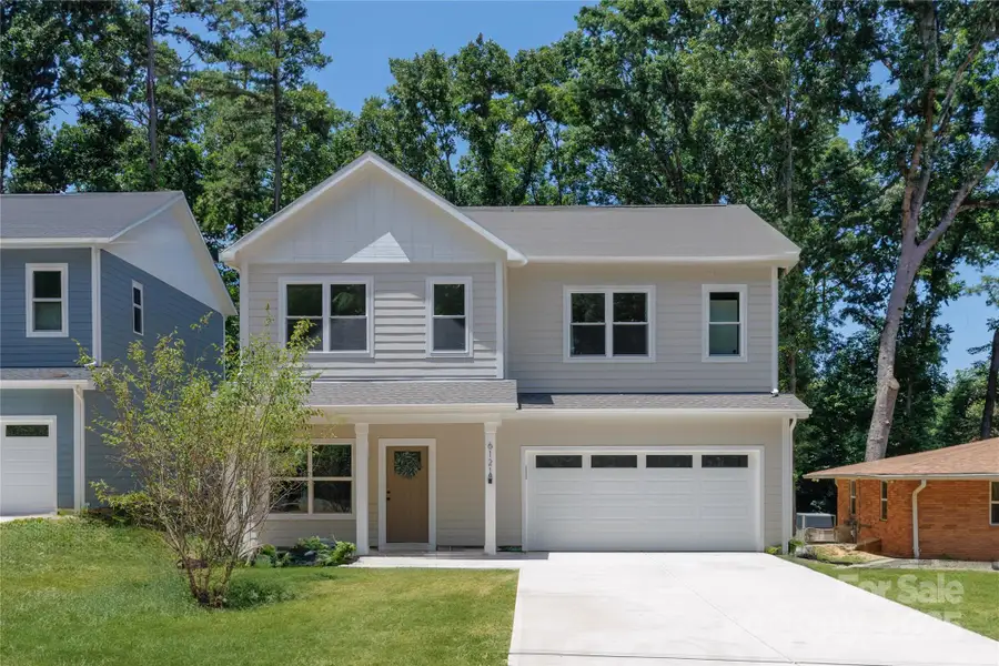 Front exterior of a new home in , Charlotte, NC, highlighting curb appeal (Image 1).