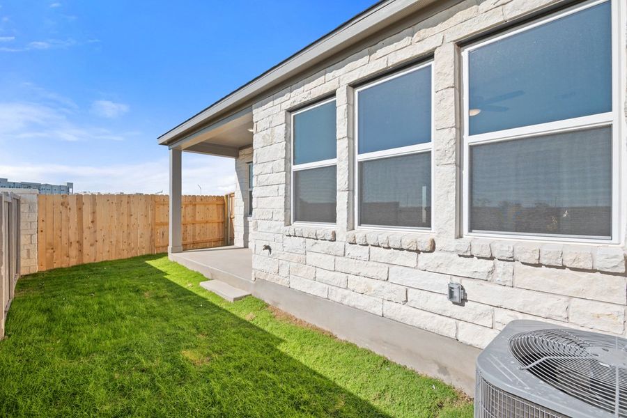Exterior details and patio area of a home in Union Collection at Park Central, Georgetown (Image 28).