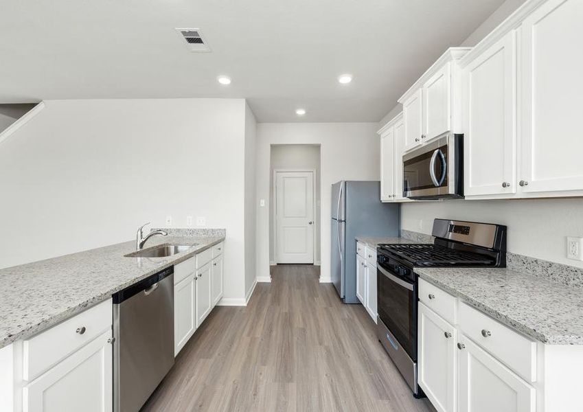 The kitchen comes with a full suite of energy-efficient appliances!