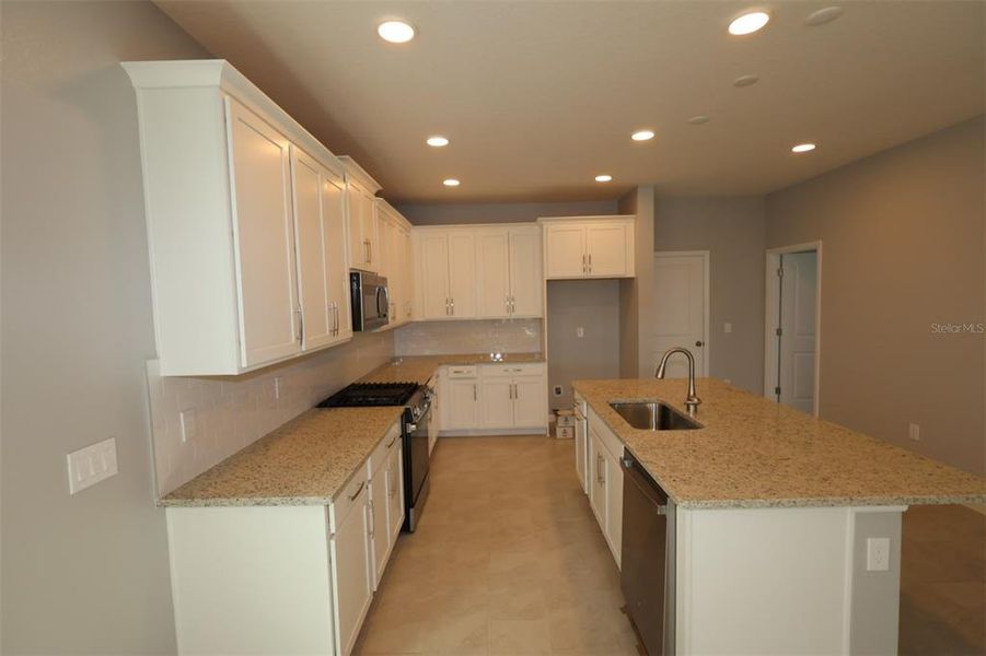 Furnished interior view inside a new home in Center Lake on the Park, St. Cloud (Image 5).
