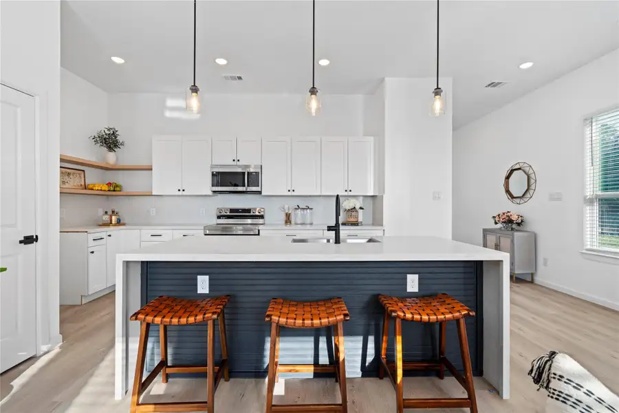 Oversized island with room for seating — perfect for quick meals or gathering with friends. Oversized island with room for seating — perfect for quick meals or gathering with friends.