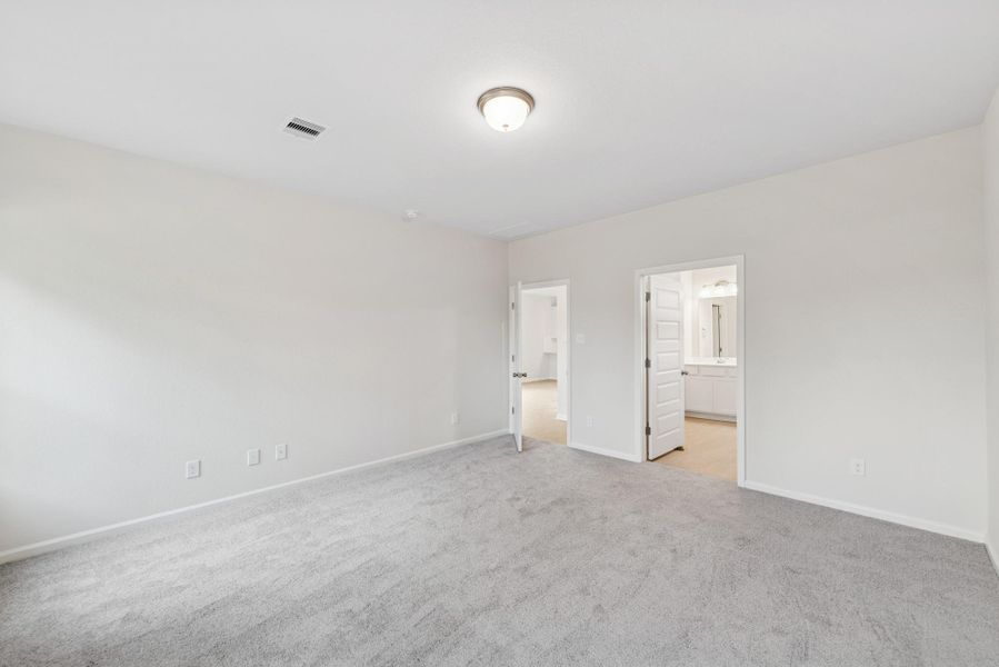 The Cardinal II- Primary Suite. Photos of home shown are for illustration only; actual features, colors, and upgrades may vary.