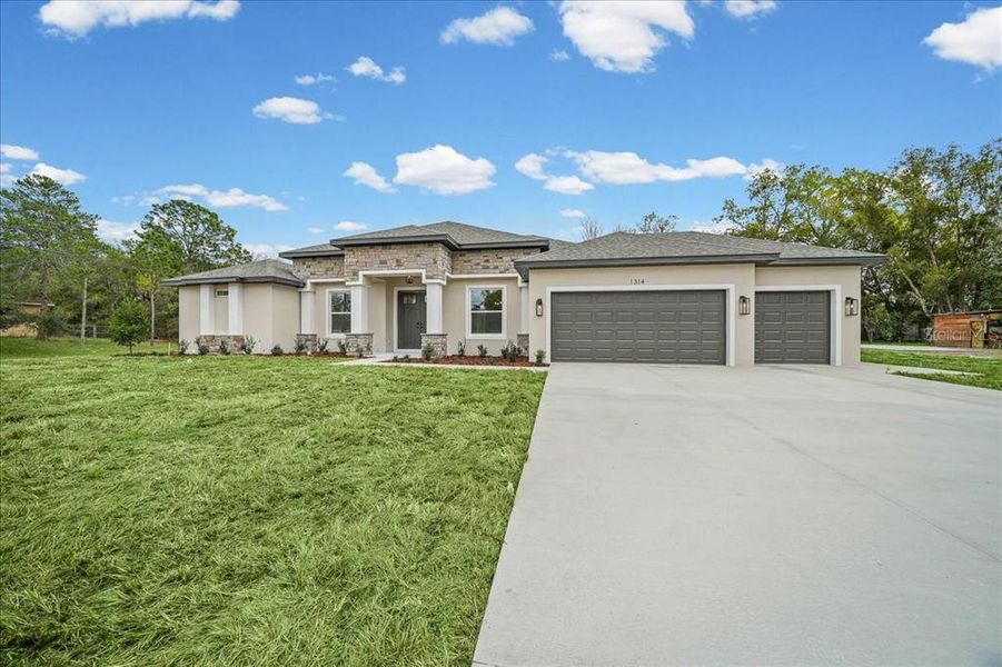 Front exterior of a new home in , Spring Hill, FL, highlighting curb appeal (Image 29). Front exterior of a new home in , Spring Hill, FL, highlighting curb appeal (Image 29).
