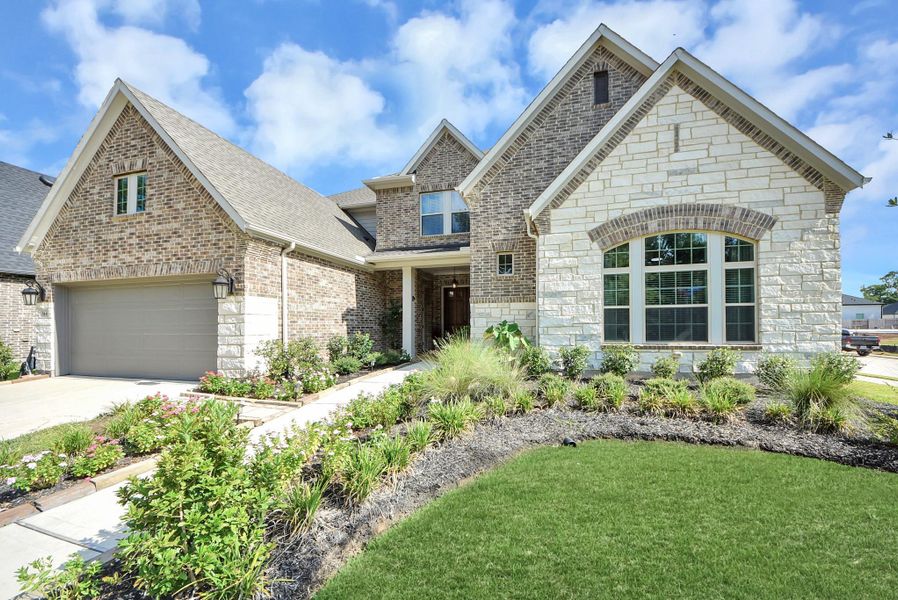Front exterior of a new home in , Missouri City, TX, highlighting curb appeal (Image 2). Front exterior of a new home in , Missouri City, TX, highlighting curb appeal (Image 2).