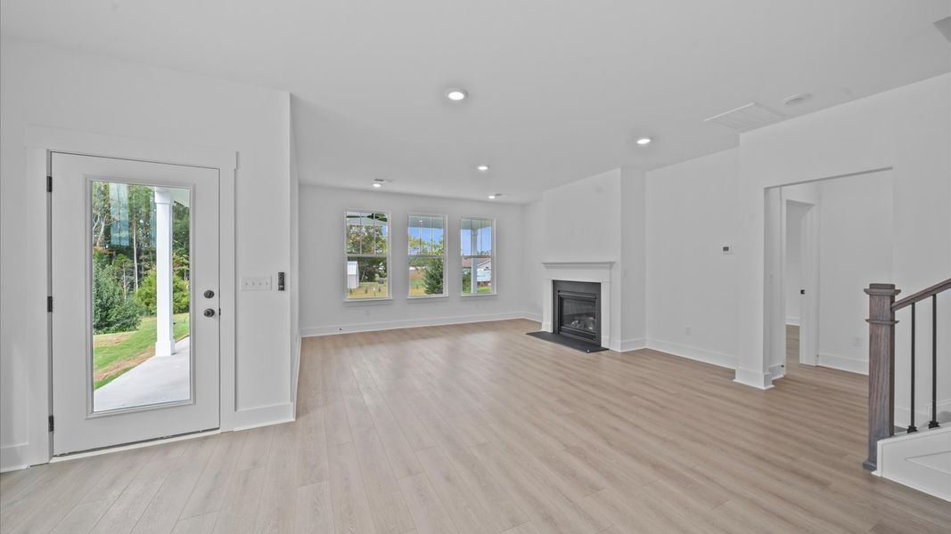 First-rate family room with thoughtful layout, fireplace, and superior connection to kitchen and dining spaces First-rate family room with thoughtful layout, fireplace, and superior connection to kitchen and dining spaces