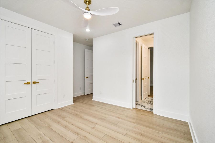 A secondary suite offering private access to a beautifully finished bathroom. The seamless flow and consistent use of modern fixtures make this an ideal space for guests or family members.