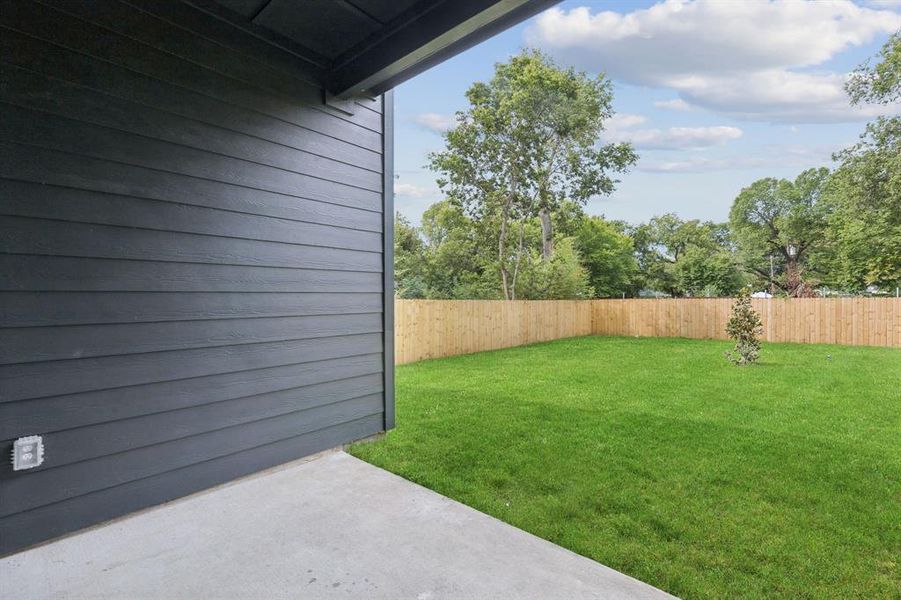 Fenced backyard featuring a patio area