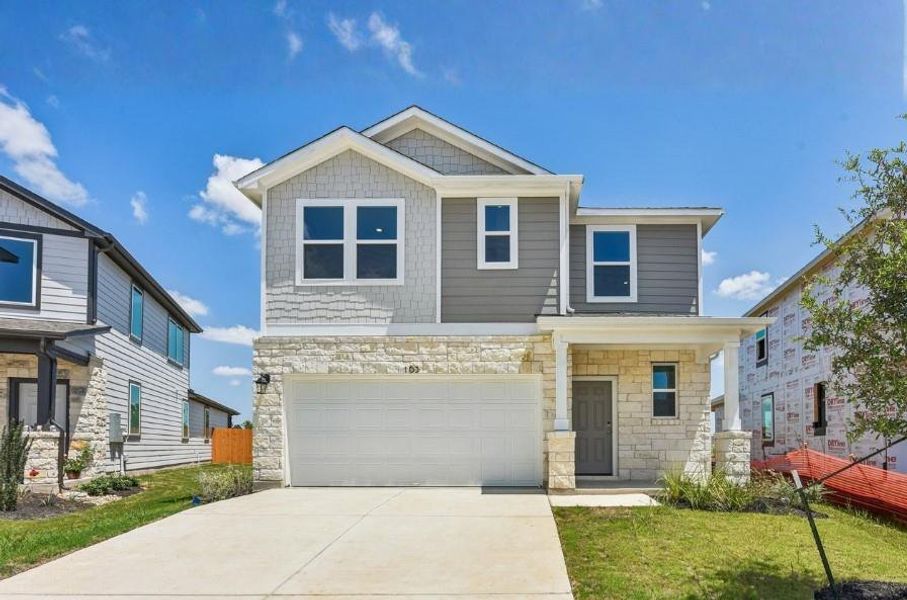 Front exterior of a new home in Trinity Ranch, Elgin, TX, highlighting curb appeal (Image 23).