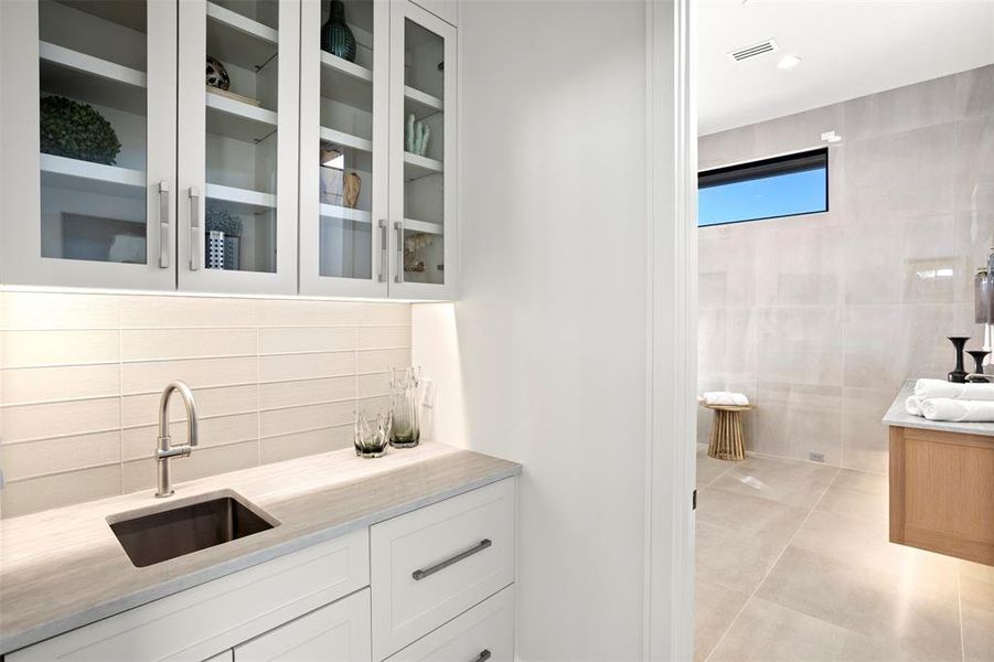 Coffee bar with hidden refrigerator drawers for your creamer of choice.