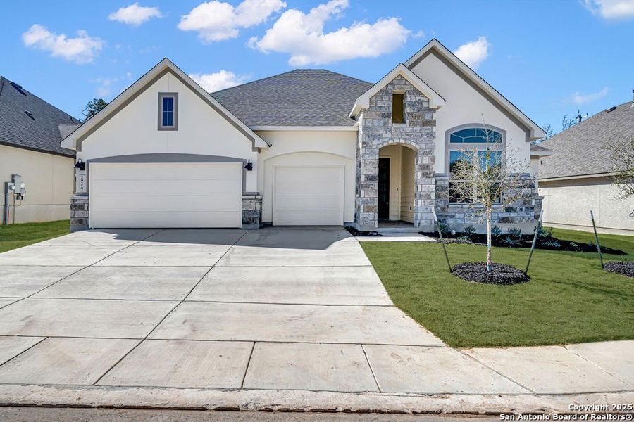 Front exterior of a new home in Elkhorn Ridge, Fair Oaks Ranch, TX, highlighting curb appeal (Image 2). Front exterior of a new home in Elkhorn Ridge, Fair Oaks Ranch, TX, highlighting curb appeal (Image 2).