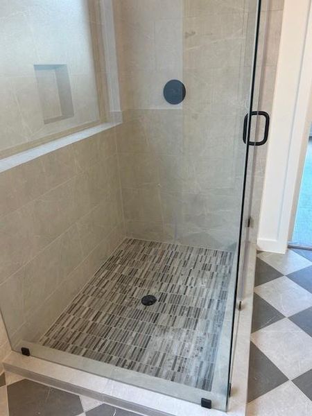 Beautiful tile combinations in the primary bath.  Free standing shower a plus.