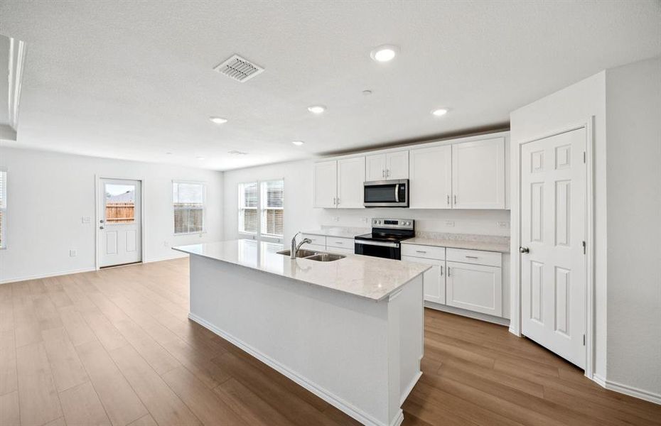 Spacious kitchen with eat-in bartop island