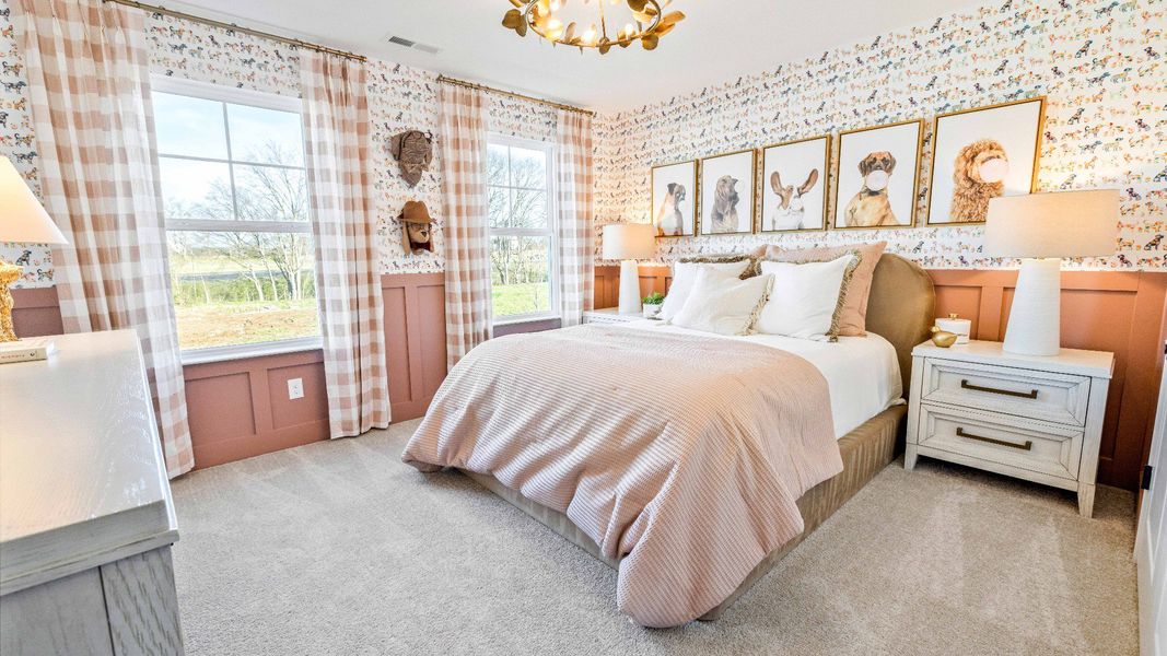 Bedroom with carpet and windows