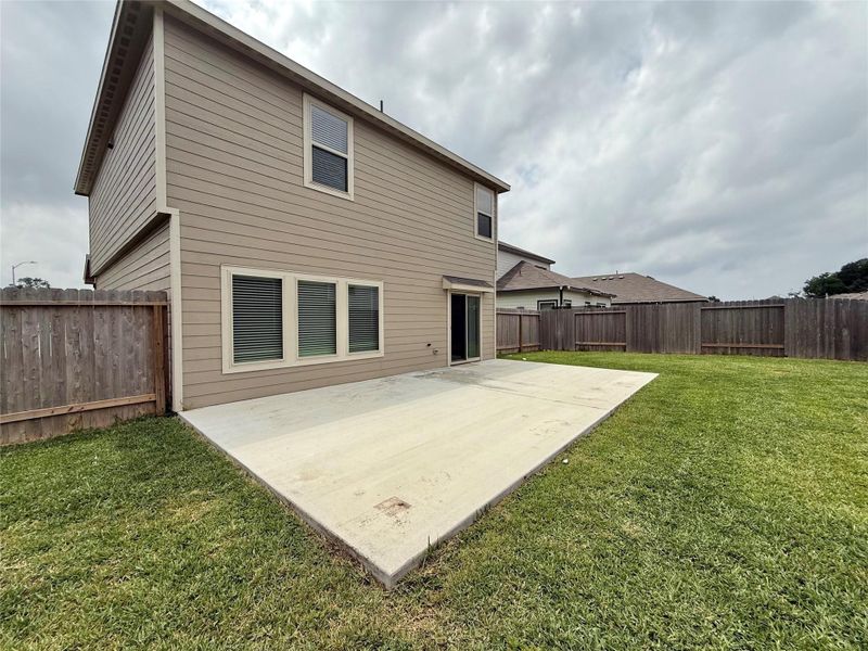 Extended patio with sliding doors and screen Extended patio with sliding doors and screen