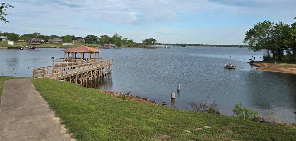 Dock area featuring a gazebo and a water view