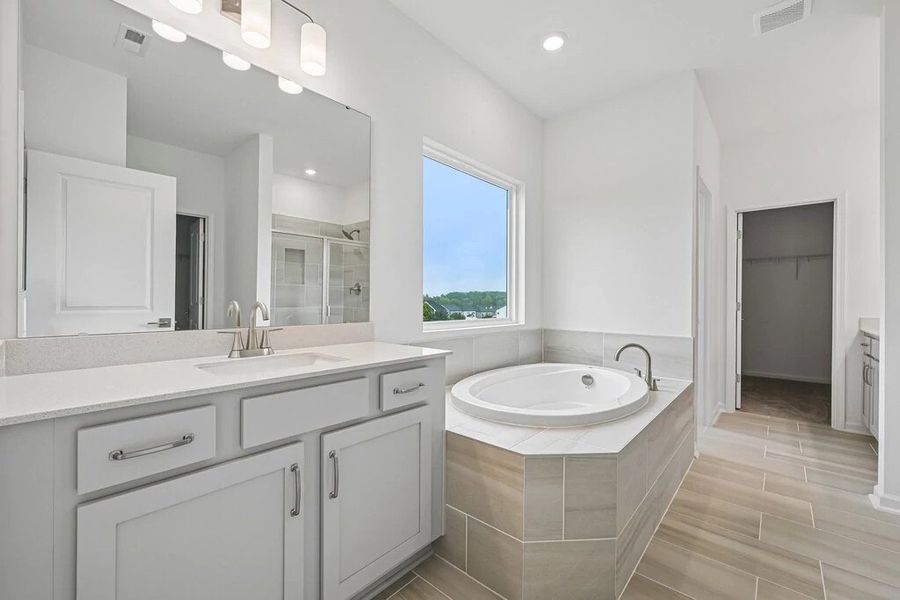 Primary Bath featuring the AW Collection® Milan - Clean geometry and high-contrast finishes. Primary Bath featuring the AW Collection® Milan - Clean geometry and high-contrast finishes.