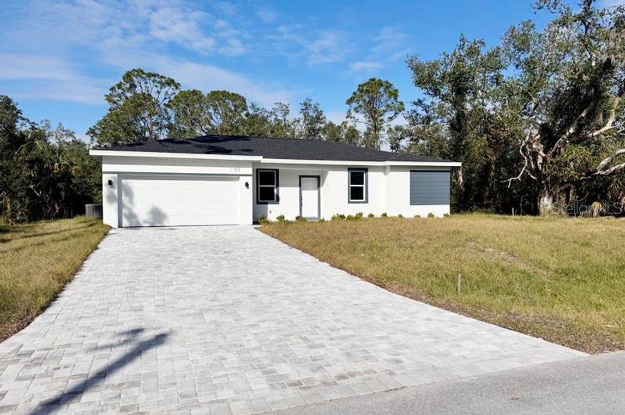 Front exterior of a new home in , Port Charlotte, FL, highlighting curb appeal (Image 2). Front exterior of a new home in , Port Charlotte, FL, highlighting curb appeal (Image 2).