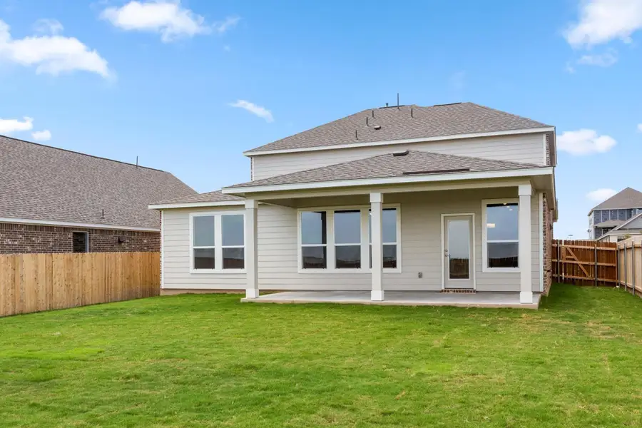 Front exterior of a new home in Salerno - Classic Collection, Round Rock, TX, highlighting curb appeal (Image 2).