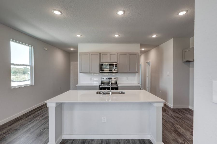 A kitchen with white cabinets. A kitchen with white cabinets.