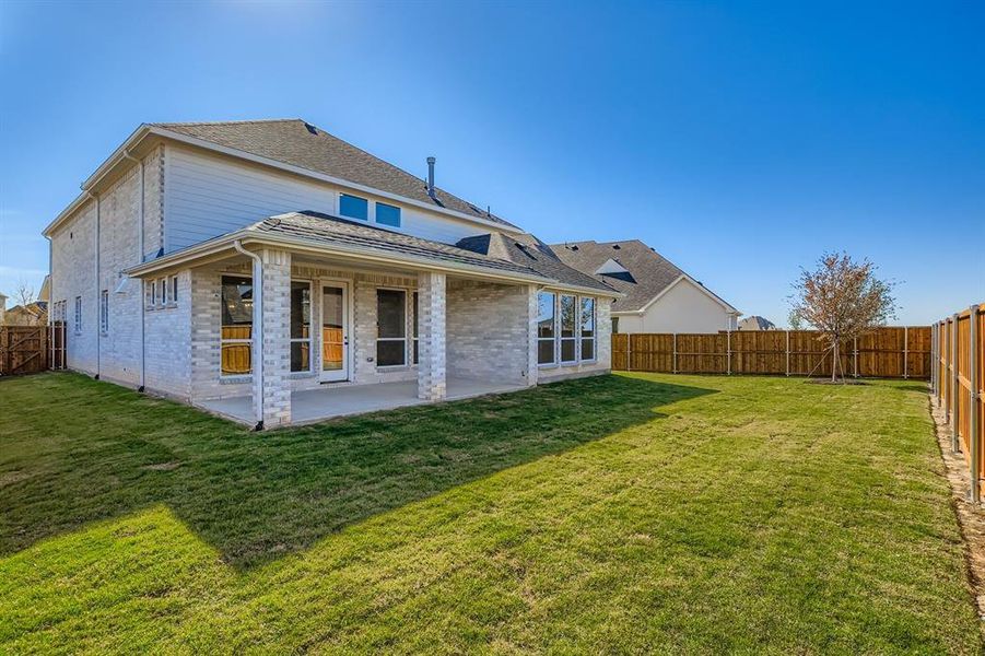 Exterior details and patio area of a home in Star Trail - 55s, Prosper (Image 18).