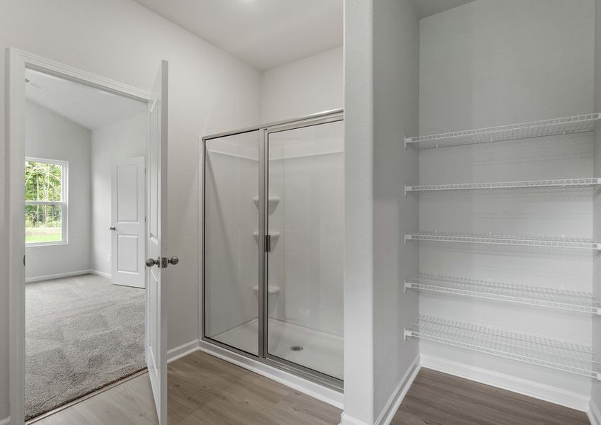 This bathroom has a glass-enclosed shower.