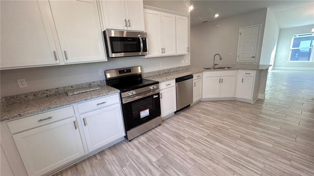 Furnished interior view inside a new home in Abbey Glen, Dade City (Image 4).