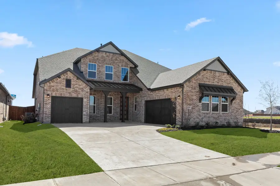Representative exterior photo of a completed home built from the Louis - 70 ft Home Site by Rockwell Homes in Nelson Lake Estates, Rockwall, TX (Image 2). Representative exterior photo of a completed home built from the Louis - 70 ft Home Site by Rockwell Homes in Nelson Lake Estates, Rockwall, TX (Image 2).