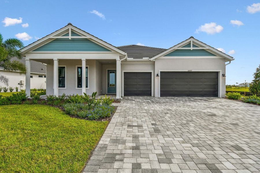 Representative exterior photo of a completed home built from the The Borrelli by David Weekley Homes in Palmera Wellen Park - Classic Series, Venice, FL (Image 1). Representative exterior photo of a completed home built from the The Borrelli by David Weekley Homes in Palmera Wellen Park - Classic Series, Venice, FL (Image 1).
