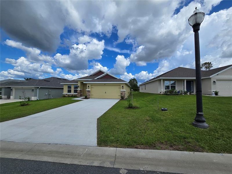 front of home with light post front of home with light post