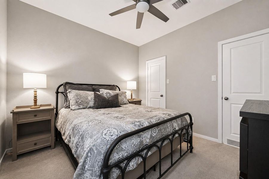 Secondary bedroom with ceiling fan and ample natural light. Secondary bedroom with ceiling fan and ample natural light.