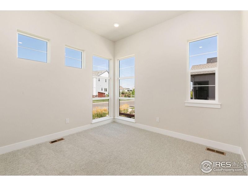 Spacious, unfurnished interior of a new home in Festival at RainDance, Windsor (Image 13).