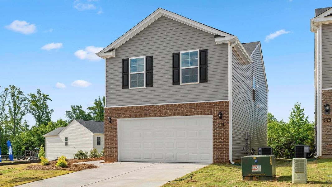 Front exterior of a new home in Willow Mill, Thomasville, NC, highlighting curb appeal (Image 13). Front exterior of a new home in Willow Mill, Thomasville, NC, highlighting curb appeal (Image 13).