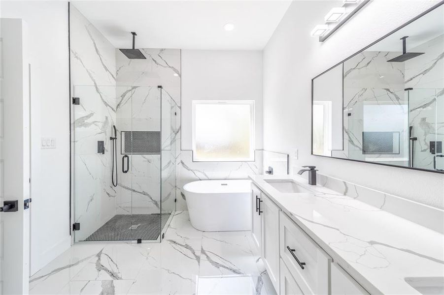 Full bath featuring a marble finish shower, a soaking tub, vanity, light marble finish floors, and recessed lighting