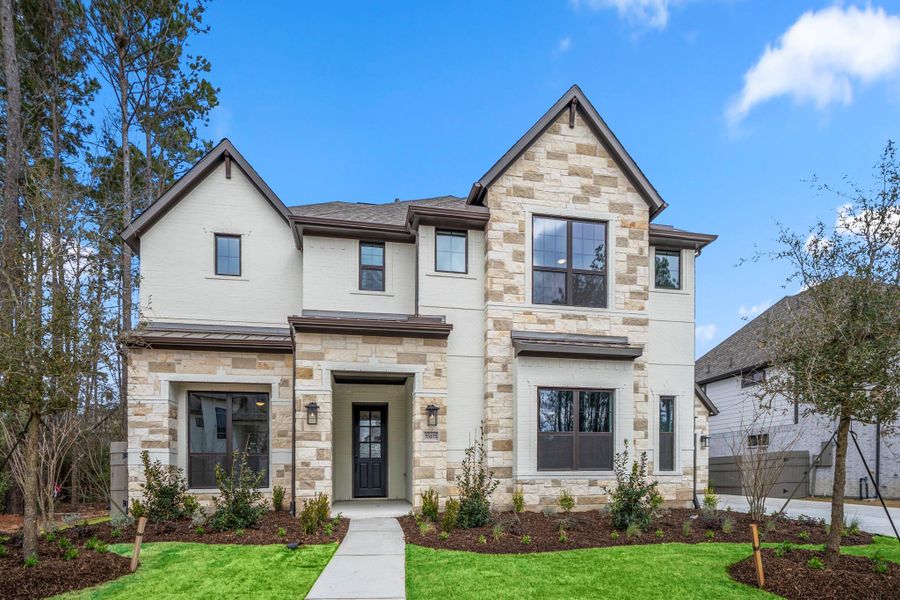 Front exterior of a new home in Artavia 70′ Lots, Conroe, TX, highlighting curb appeal (Image 2).