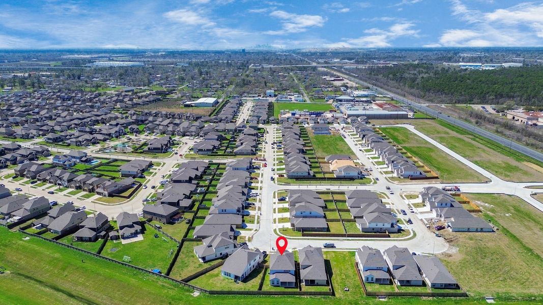 An aerial view of a spacious subdivision lot, highlighting a well-maintained yard and a fully fenced perimeter, offering both privacy and expansive outdoor space. An aerial view of a spacious subdivision lot, highlighting a well-maintained yard and a fully fenced perimeter, offering both privacy and expansive outdoor space.