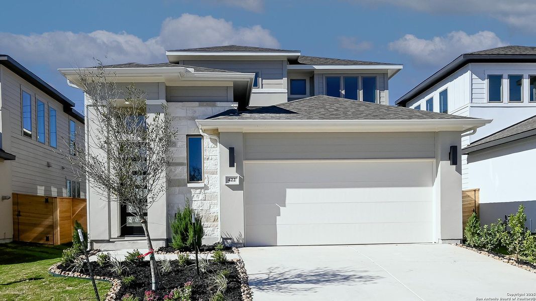 Front exterior of a new home in Solms Landing 45', New Braunfels, TX, highlighting curb appeal (Image 19).