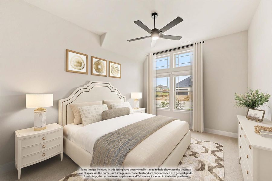 Bedroom with upholstered headboard, ceiling fan, large window, and neutral carpet flooring Bedroom with upholstered headboard, ceiling fan, large window, and neutral carpet flooring