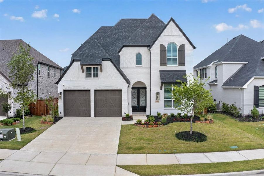 Front exterior of a new home in Star Trail, Prosper, TX, highlighting curb appeal (Image 2). Front exterior of a new home in Star Trail, Prosper, TX, highlighting curb appeal (Image 2).