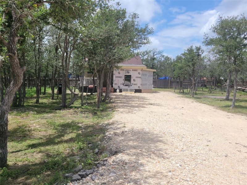 A secluded dwelling nestled amidst verdant trees offers a private retreat with an inviting covered deck. A secluded dwelling nestled amidst verdant trees offers a private retreat with an inviting covered deck.