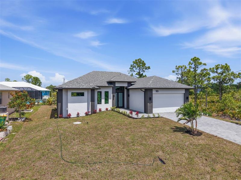 Front exterior of a new home in , Placida, FL, highlighting curb appeal (Image 19).