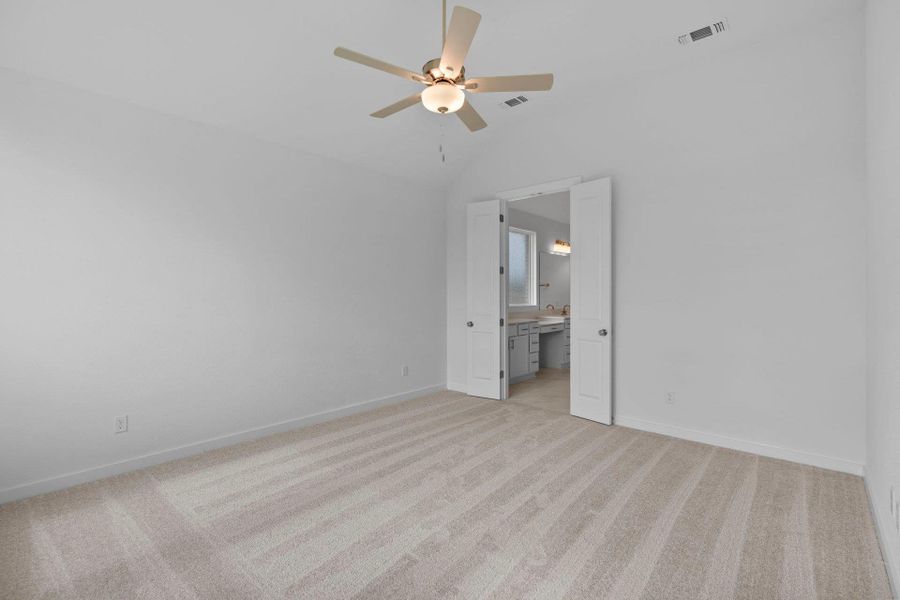 Primary Bedroom with elevated ceiling Primary Bedroom with elevated ceiling