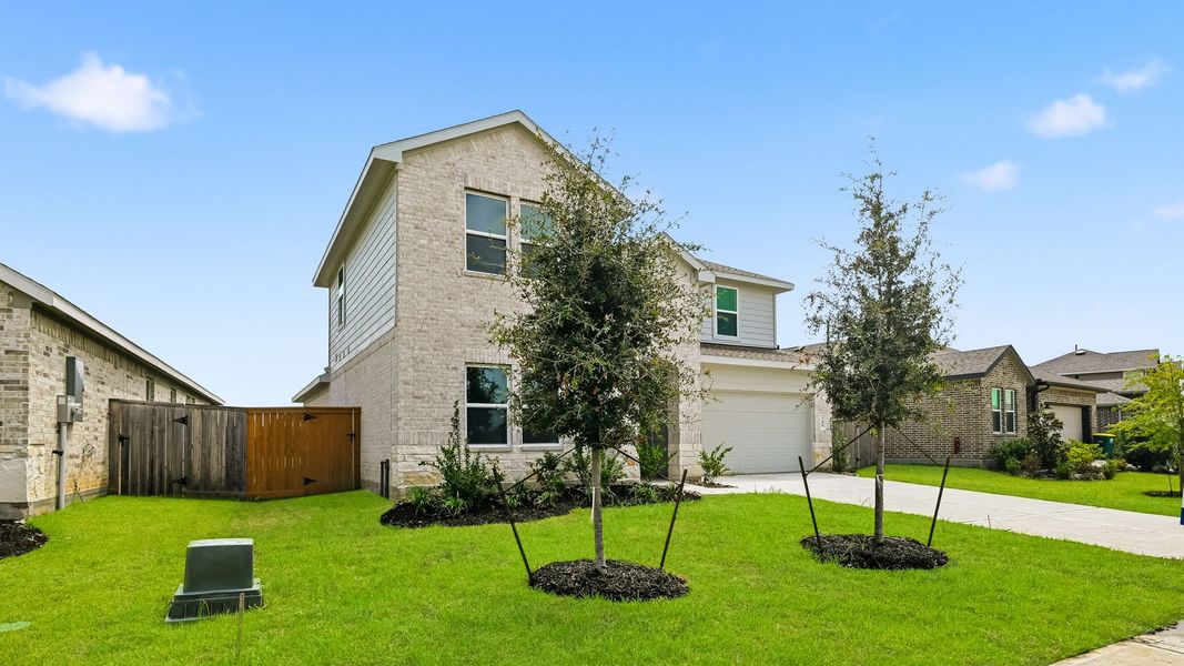 Front exterior of a new home in River Ranch Trails, Dayton, TX, highlighting curb appeal (Image 2). Front exterior of a new home in River Ranch Trails, Dayton, TX, highlighting curb appeal (Image 2).